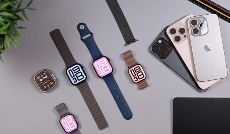 Apple Watch models and iPhones on a desk for how to set up Apple Watch.