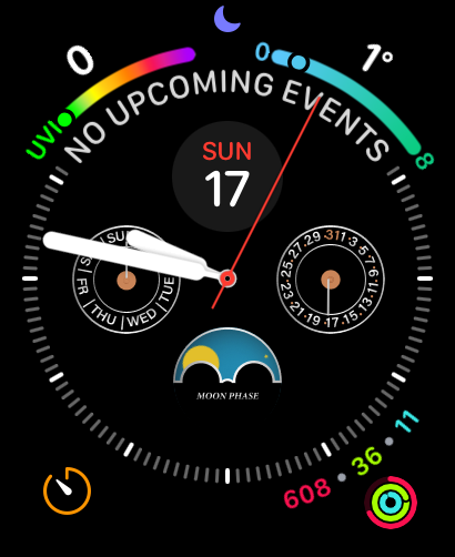 A Cosmo Native watch face featuring a moon phase complication, day and date dials, and colorful activity rings