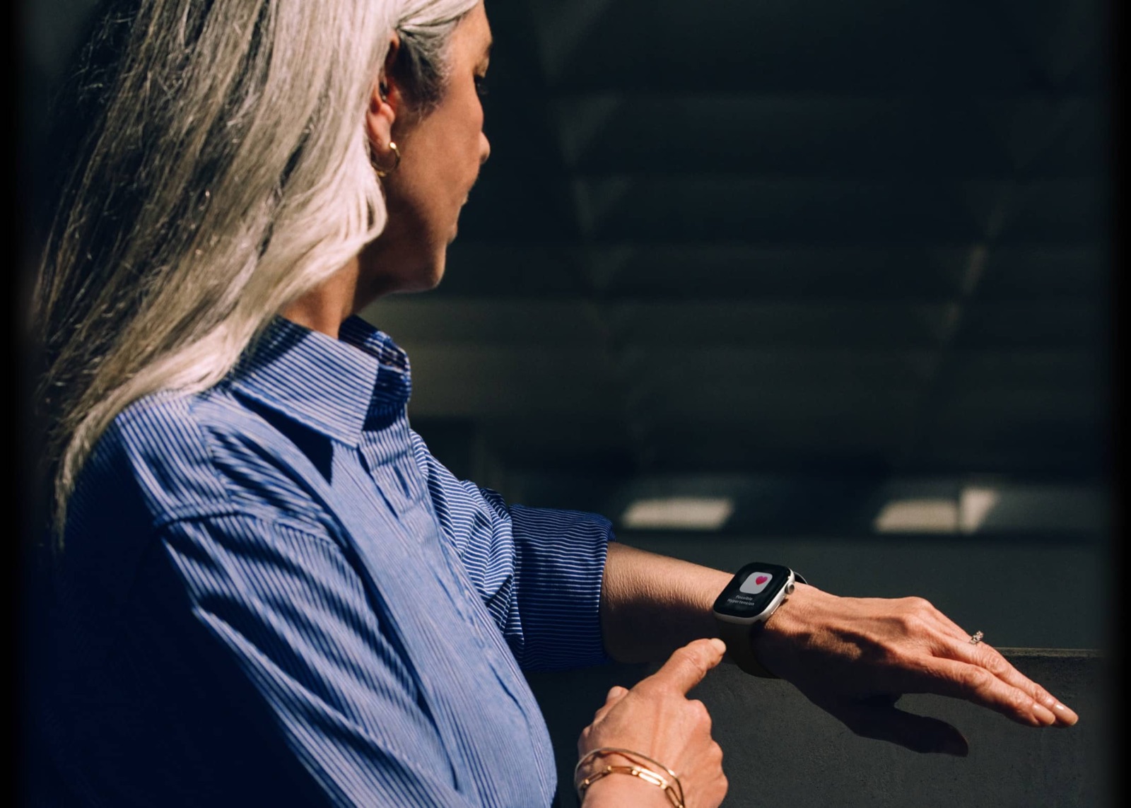 A person viewing Apple Watch Series 11 health features on the wrist